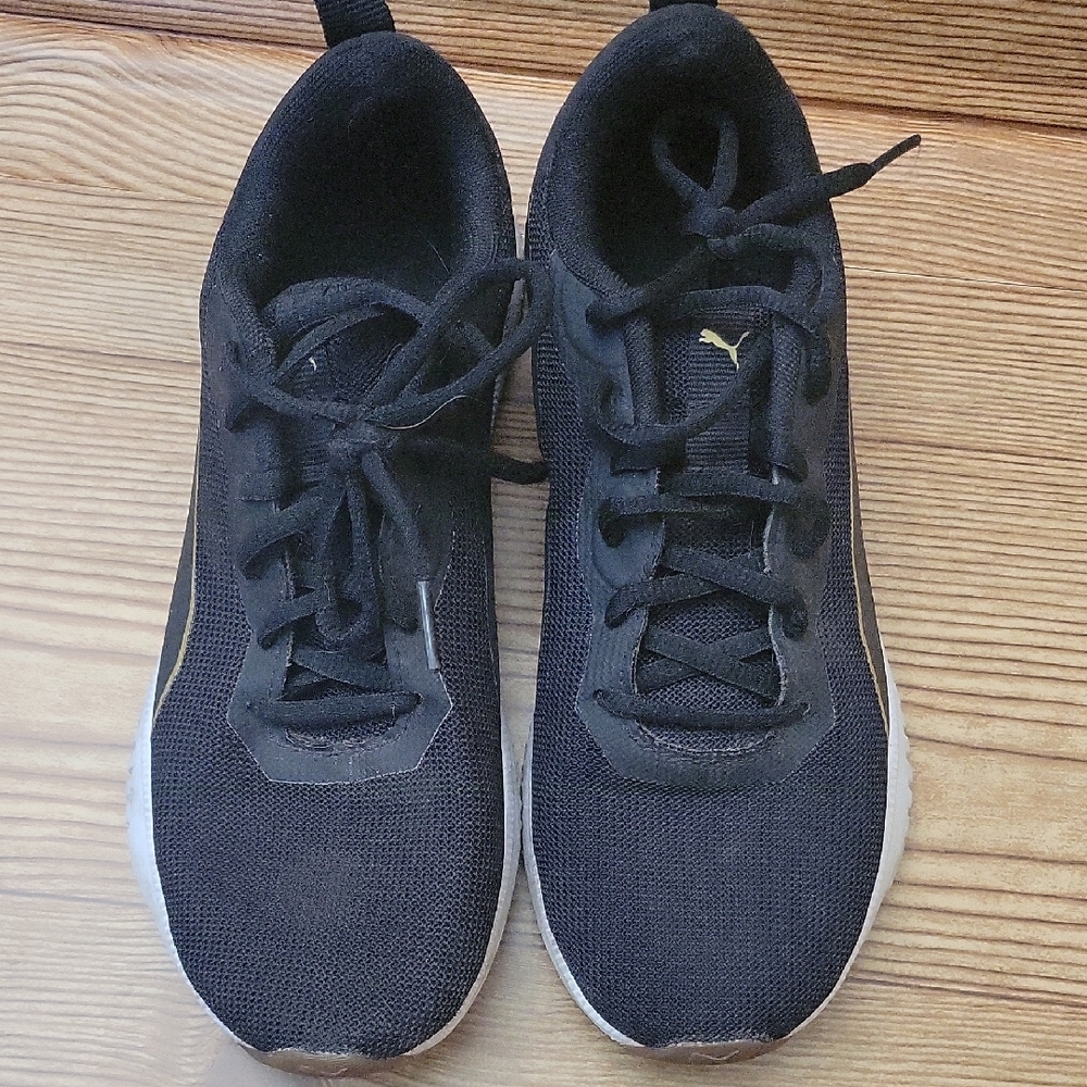 Puma Black Athletic Shoes with Gold Accents